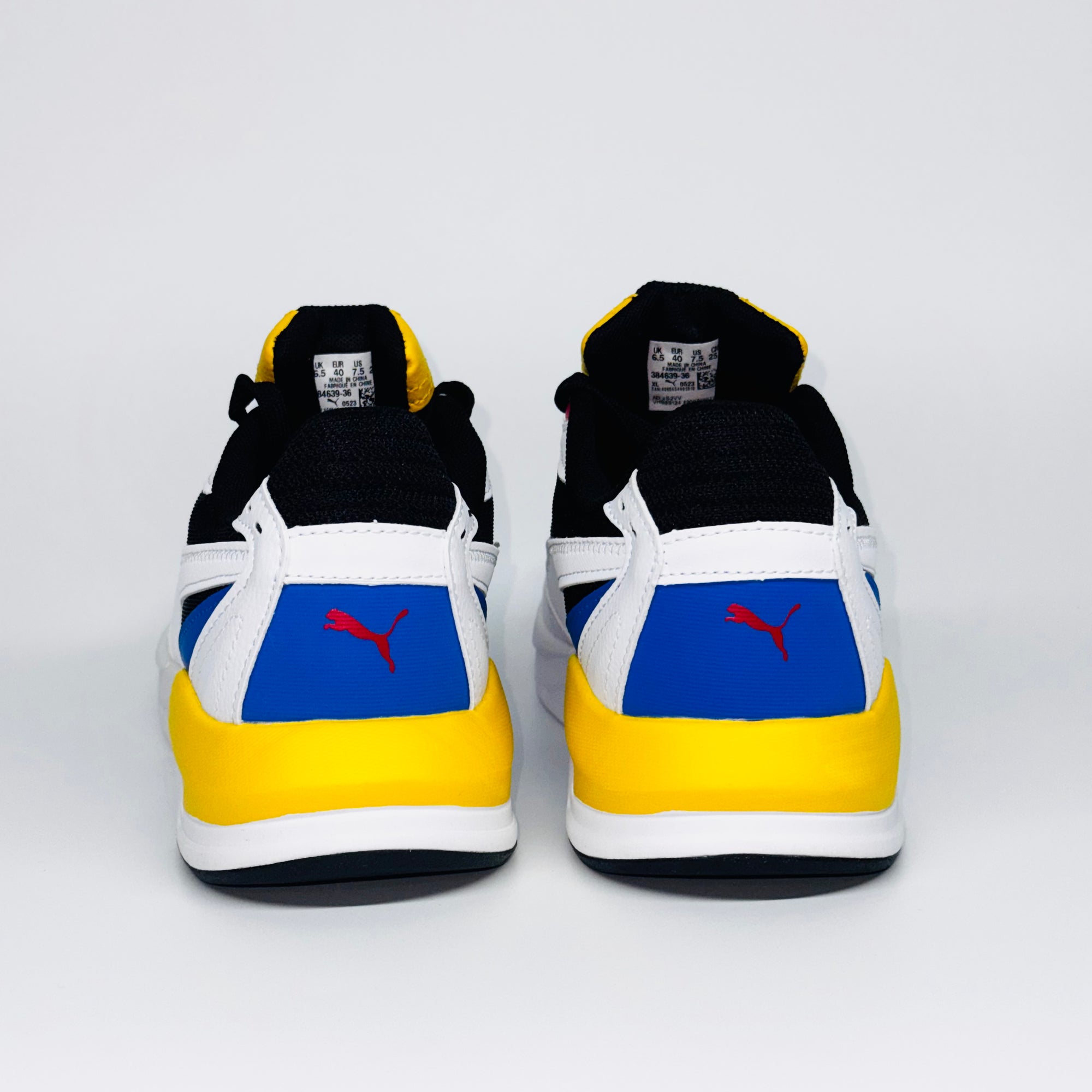 Чоловічі кросівки Puma X Ray Speed Lite білі, з контрасними жовтими, синіми і чорними елементами, європейський бренд.